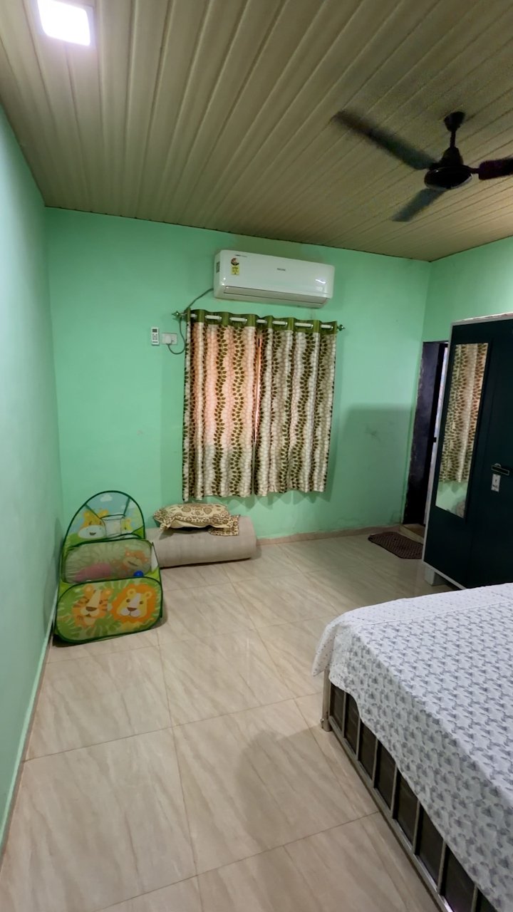 Cozy air-conditioned bedroom at Nirvi Farms